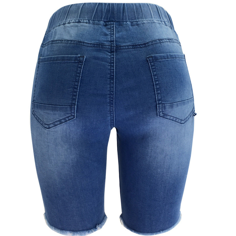 Spring rasgou calças de jeans azul elásticas de canto médio