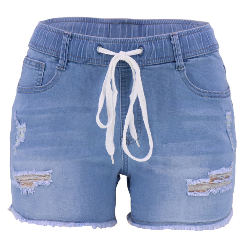 Temperamento de la cuerda elástica conmutada jeans lavados con rayos delgados de cintura alta